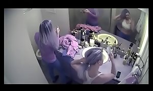 Purple haired college girls getting ready for a night out while one dances naked