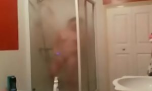 Sexy brit doesn't realize she's being watched while showering