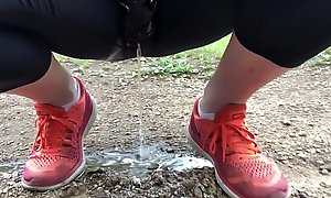pissing leggings in the park on the trail
